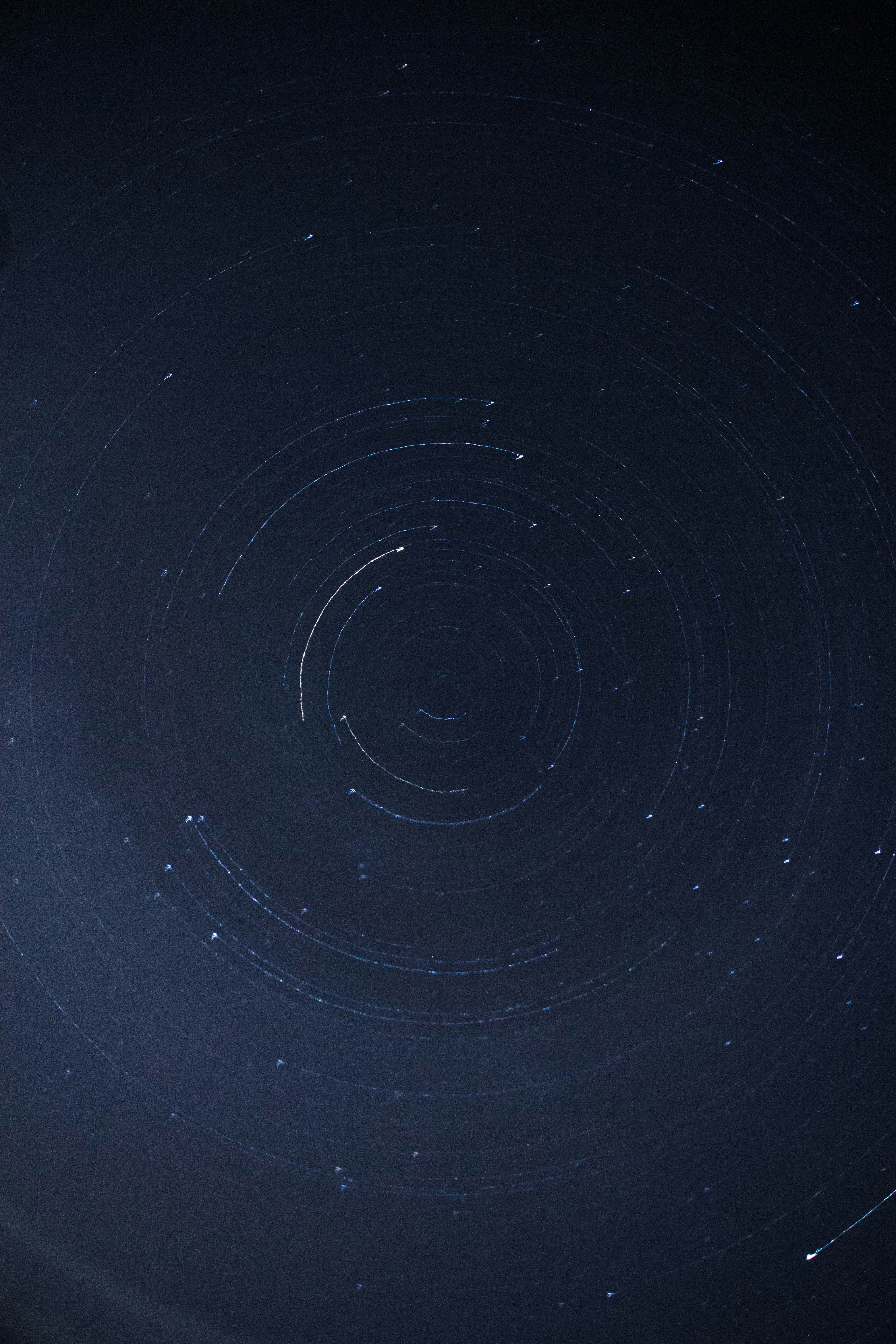 woman wearing yellow long-sleeved dress under white clouds and blue sky during daytime