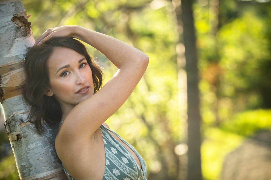 woman in gray tank top smiling