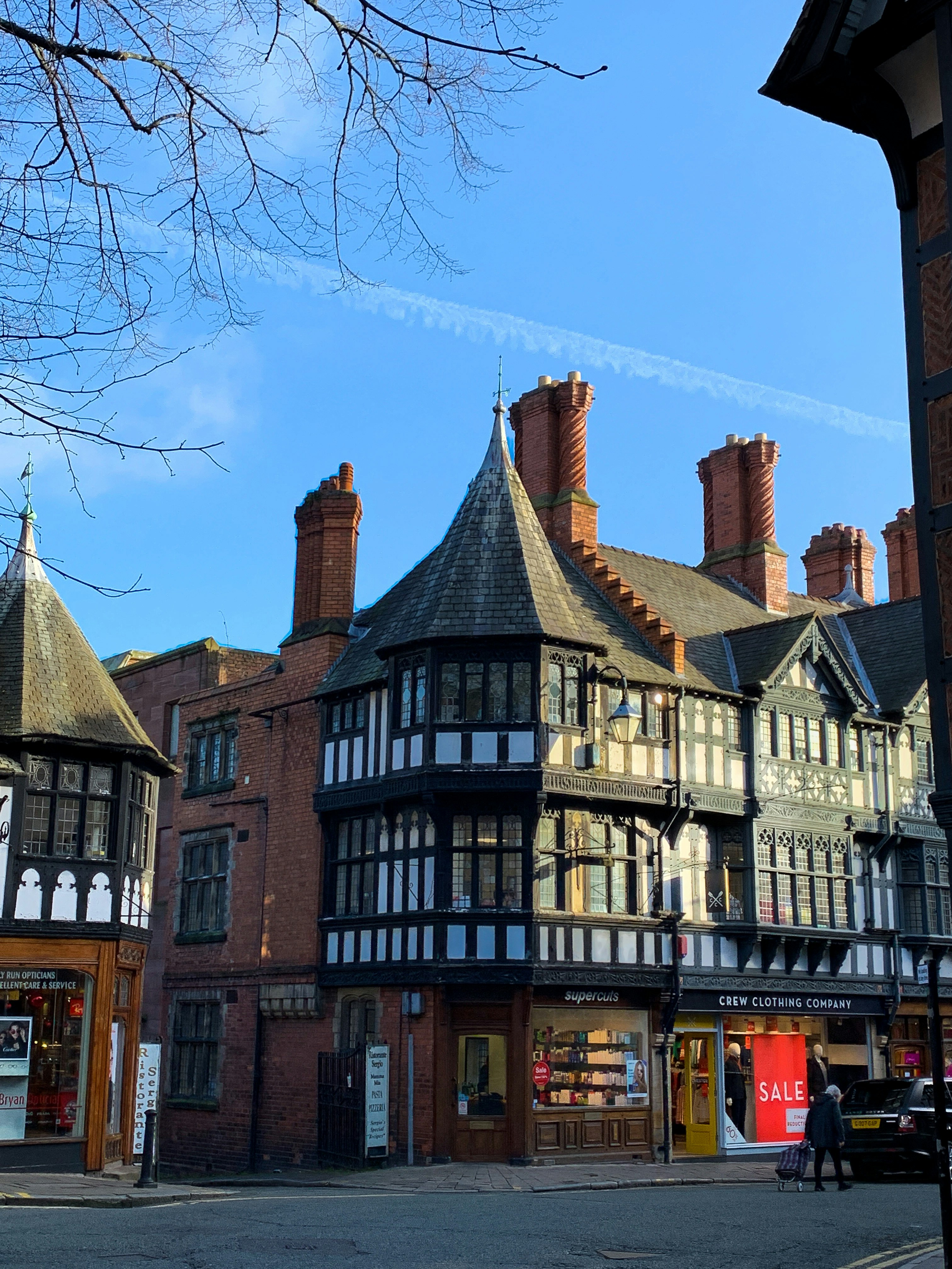 brown and white concrete building under blue sky during daytime
