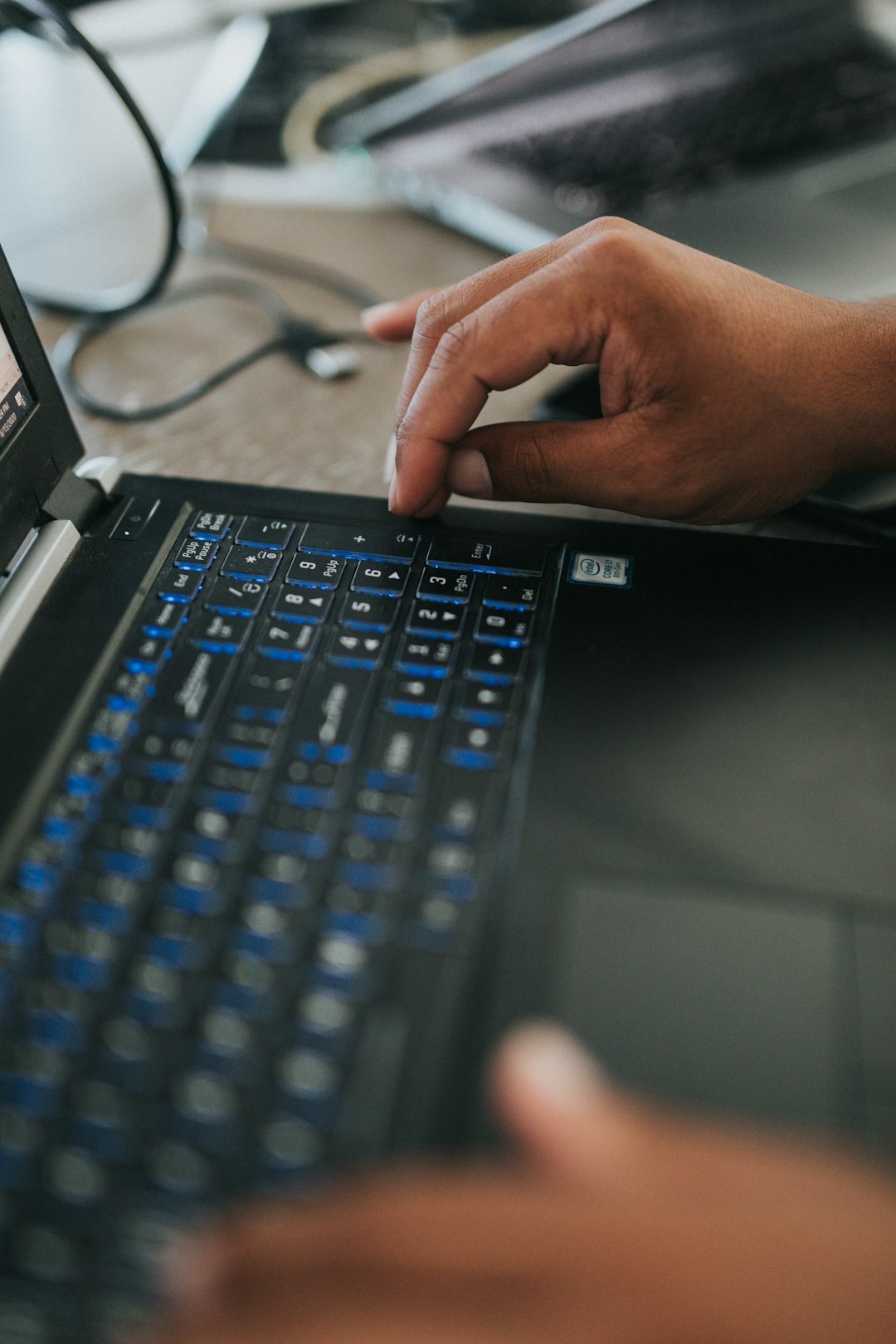 person using black laptop computer