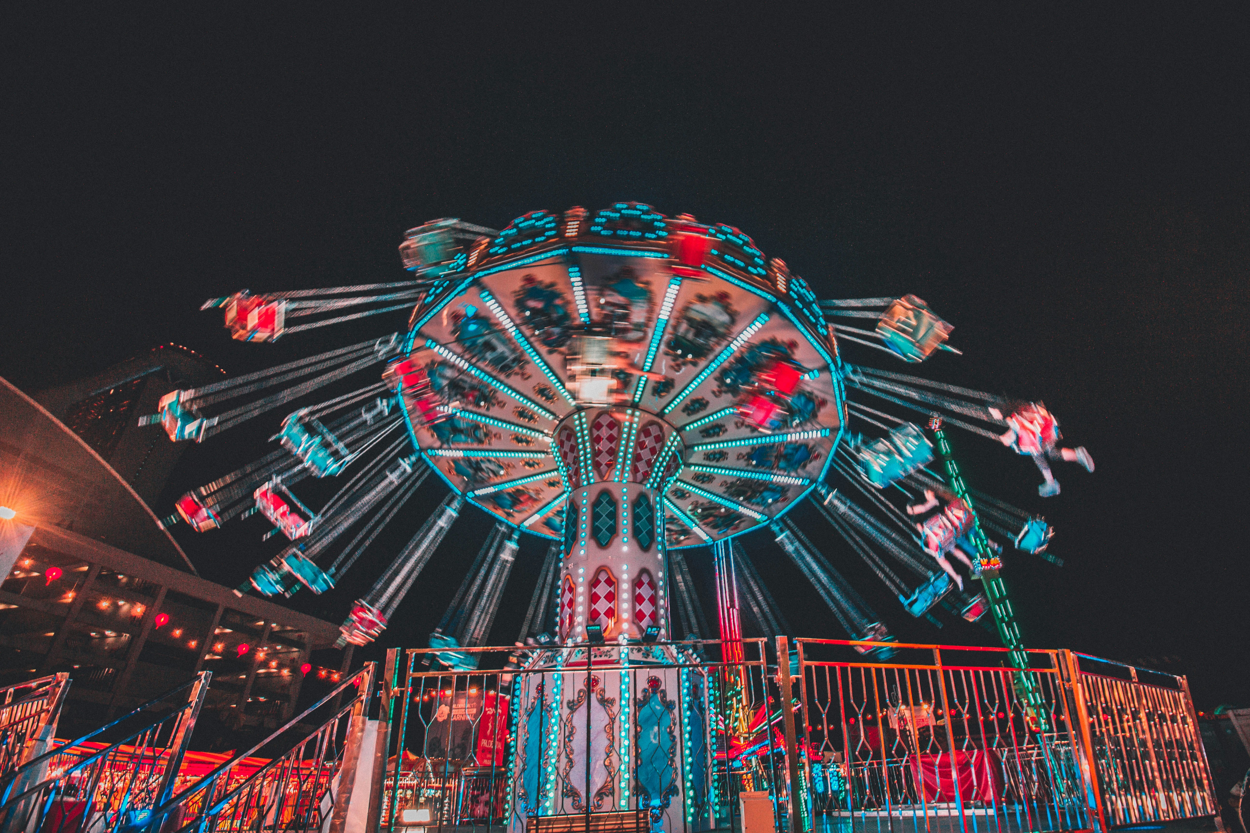 red and blue ferris wheel during night time