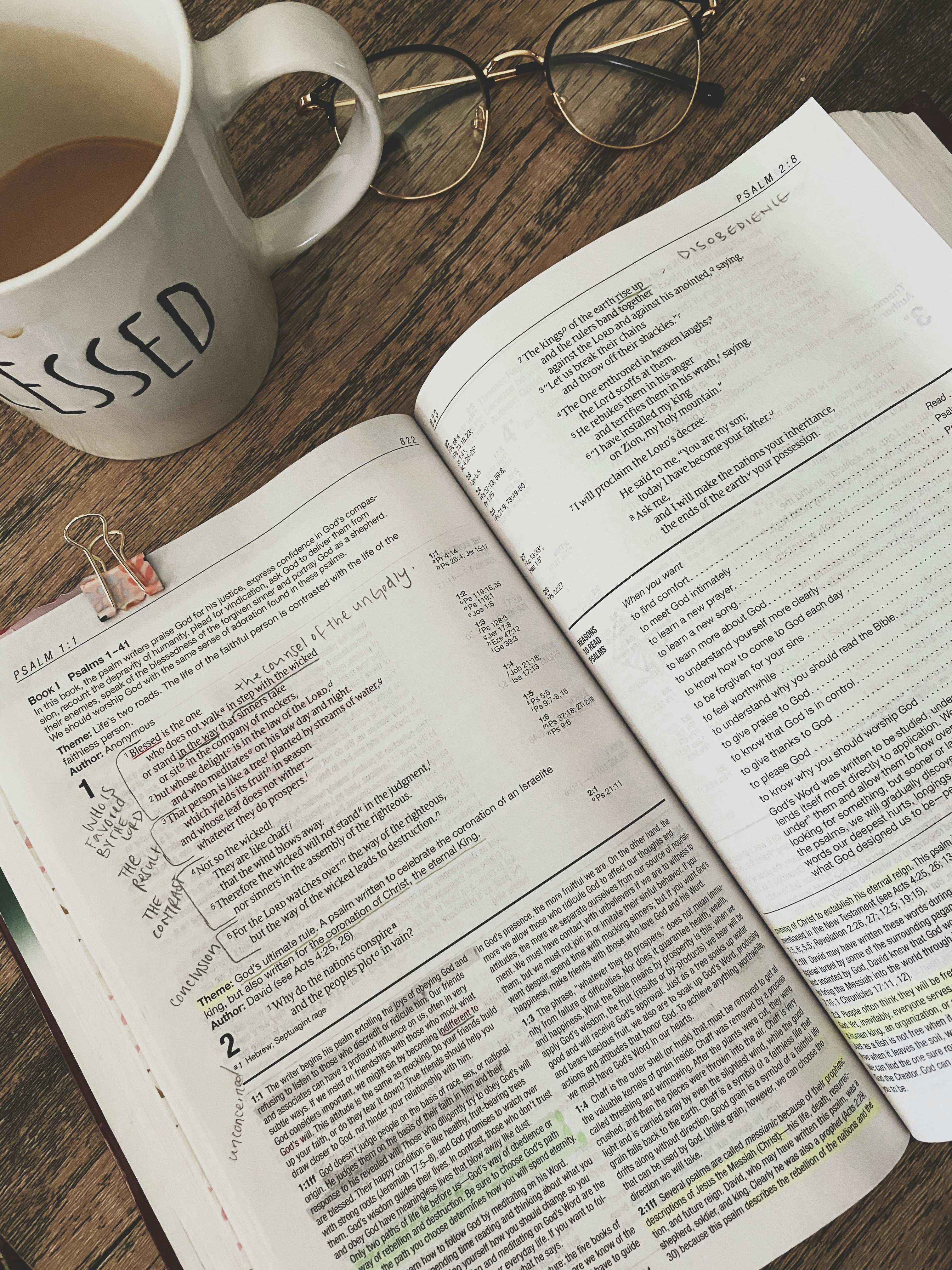 white printer paper beside white ceramic mug