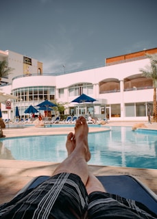 Comfortable swim trunks laid out on poolside lounge