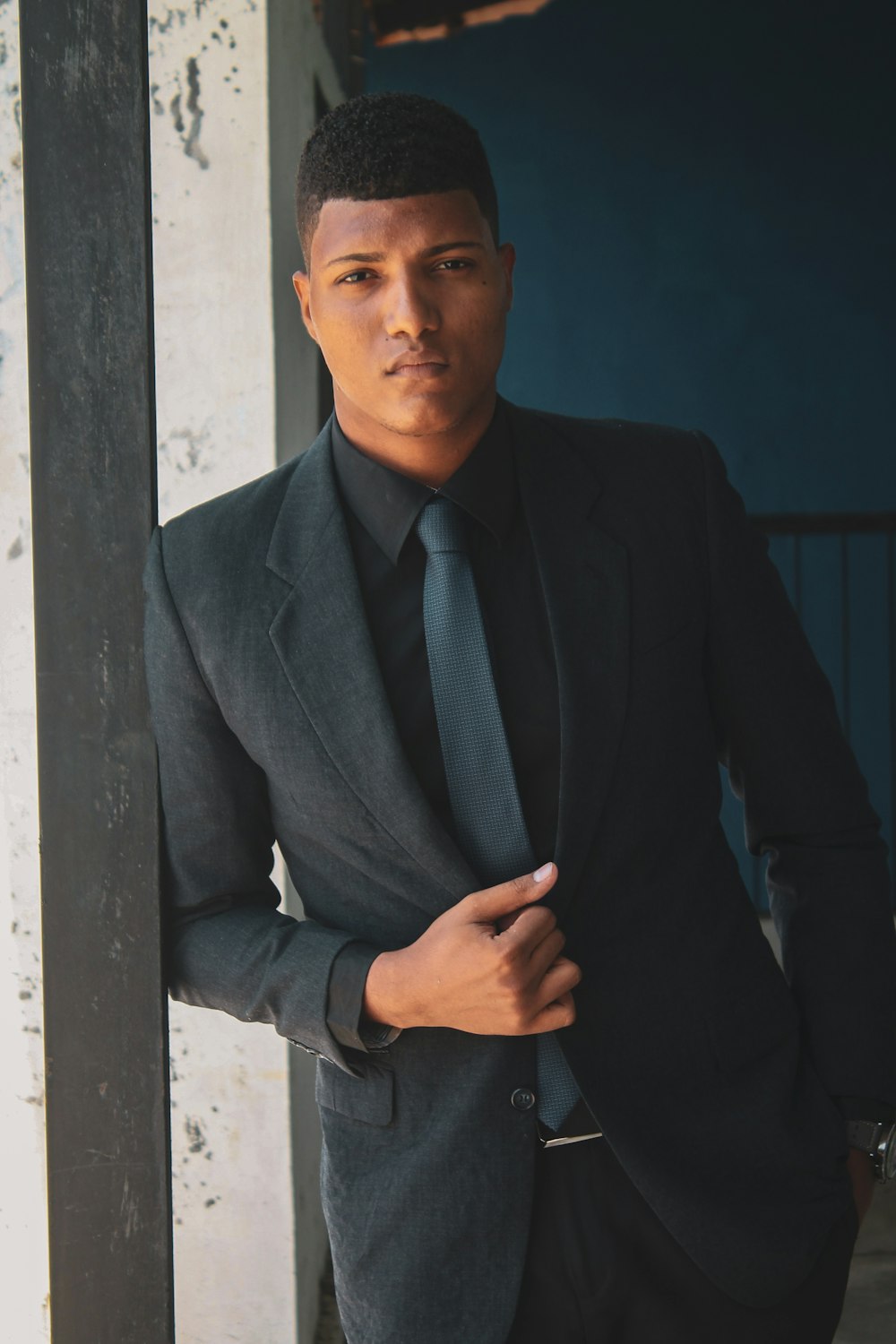 man in black suit jacket and blue dress shirt