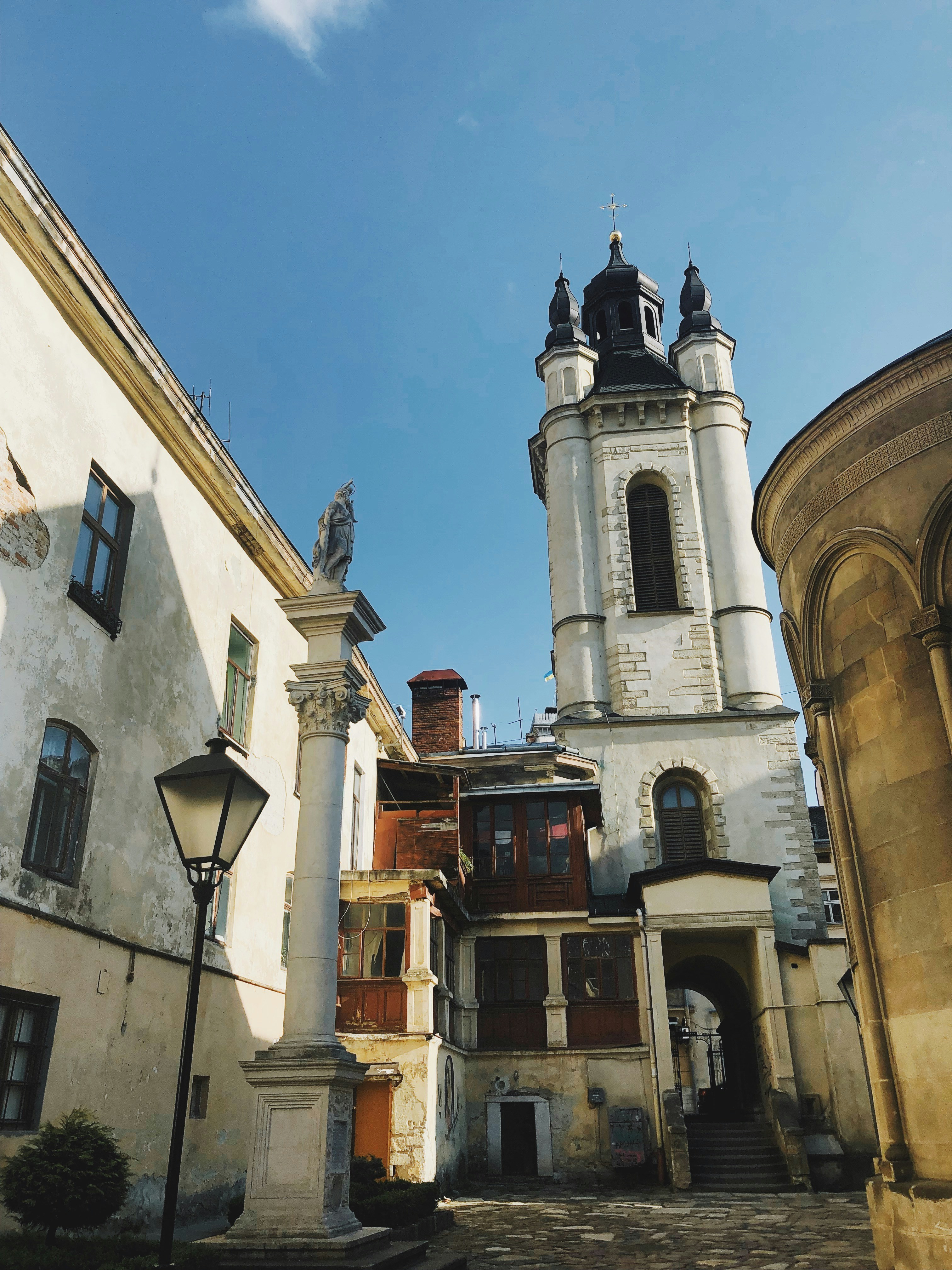 white and brown concrete building under blue sky during daytime