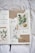 A journal spread features botanical illustrations and handwritten words. The left side displays a drawing of flowers and leaves, while the right side contains images of a sweet orange and lavender. Words like 'faith,' 'hope,' and 'love' are thoughtfully written around the illustrations. The page has a textured and artistic feel with the use of tape and torn paper.