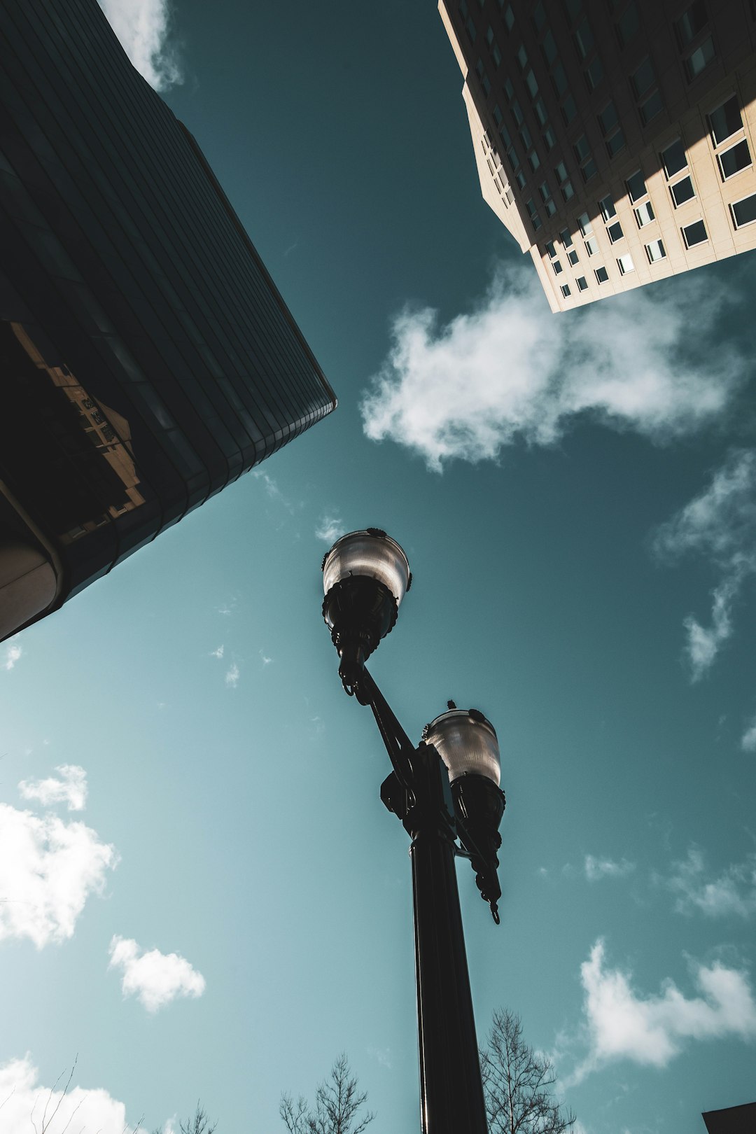 black and white street light under blue sky during daytime