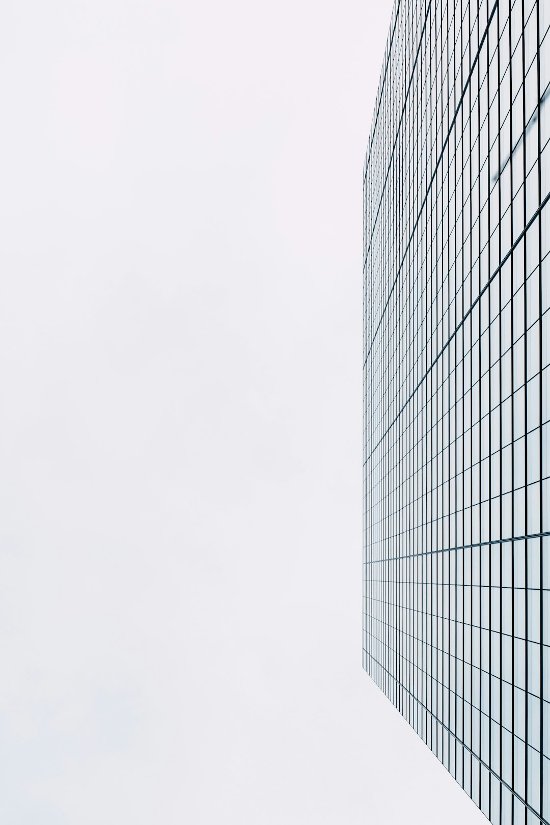 black and white glass walled high rise building