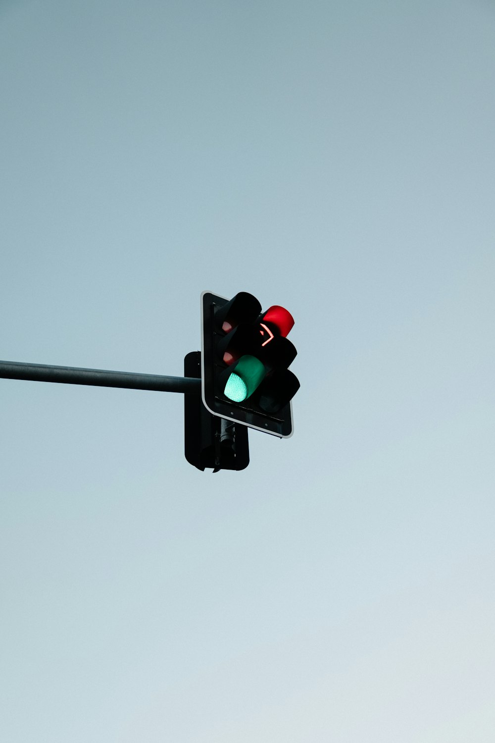 black traffic light with green light