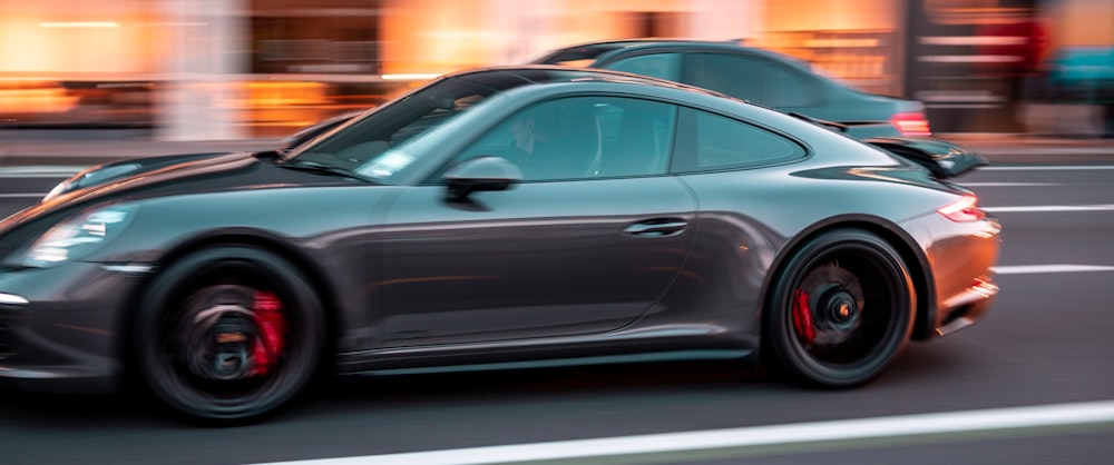 black sedan on road during daytime