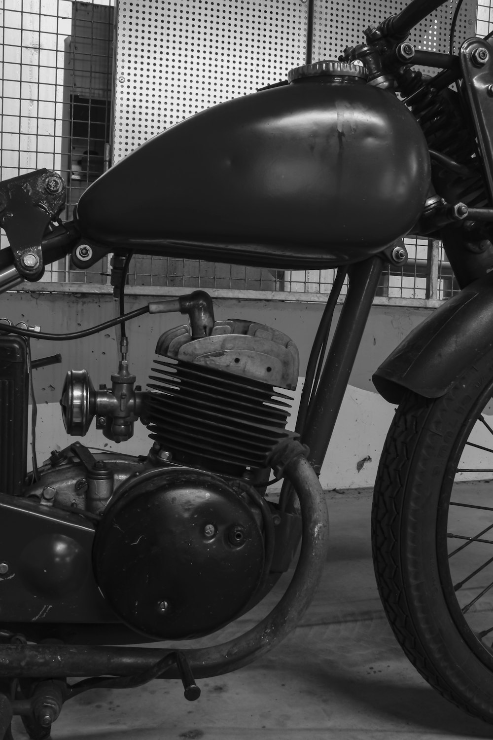 grayscale photo of vintage motorcycle
