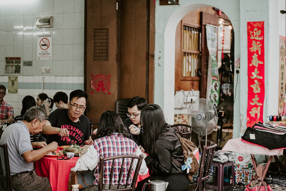 people sitting on chair in restaurant