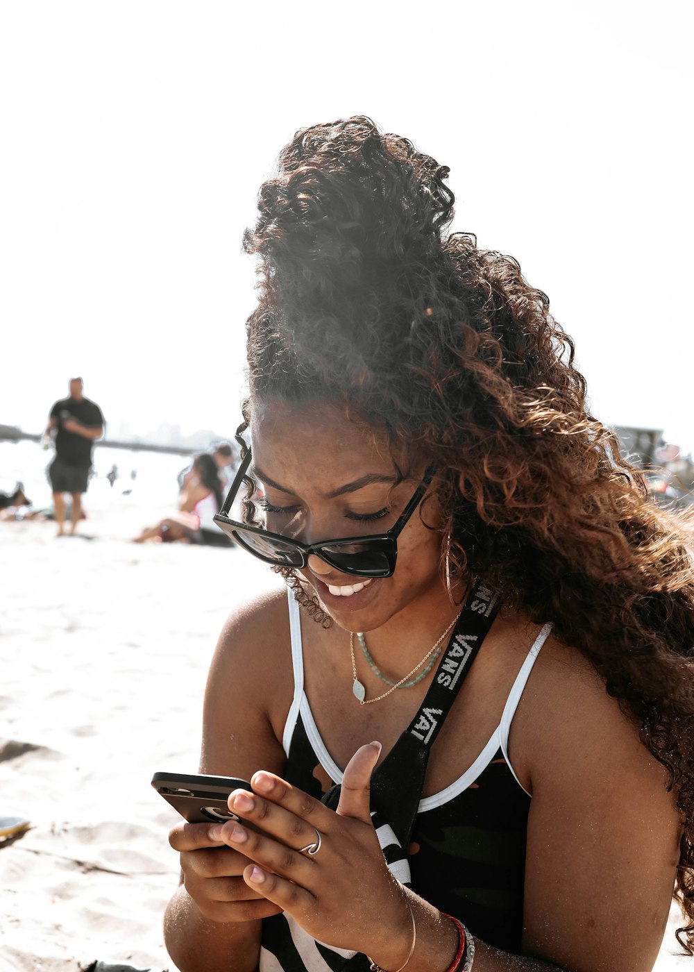 woman in black tank top wearing black framed eyeglasses