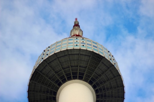 white and gray round building under blue sky during daytime in Seoul Tower South Korea
