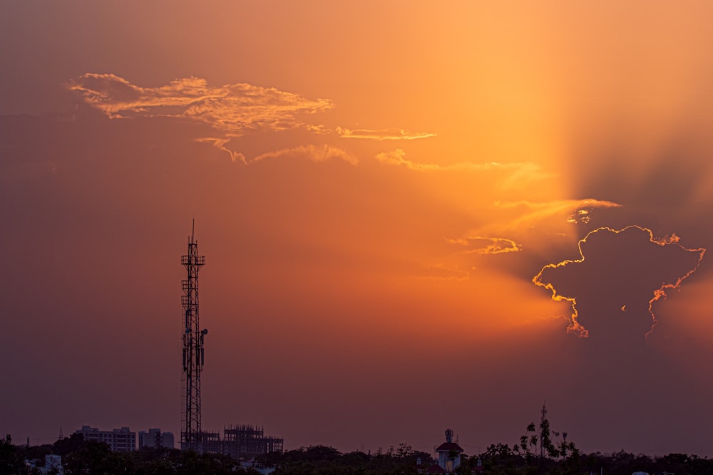 silhouette of city buildings during sunset