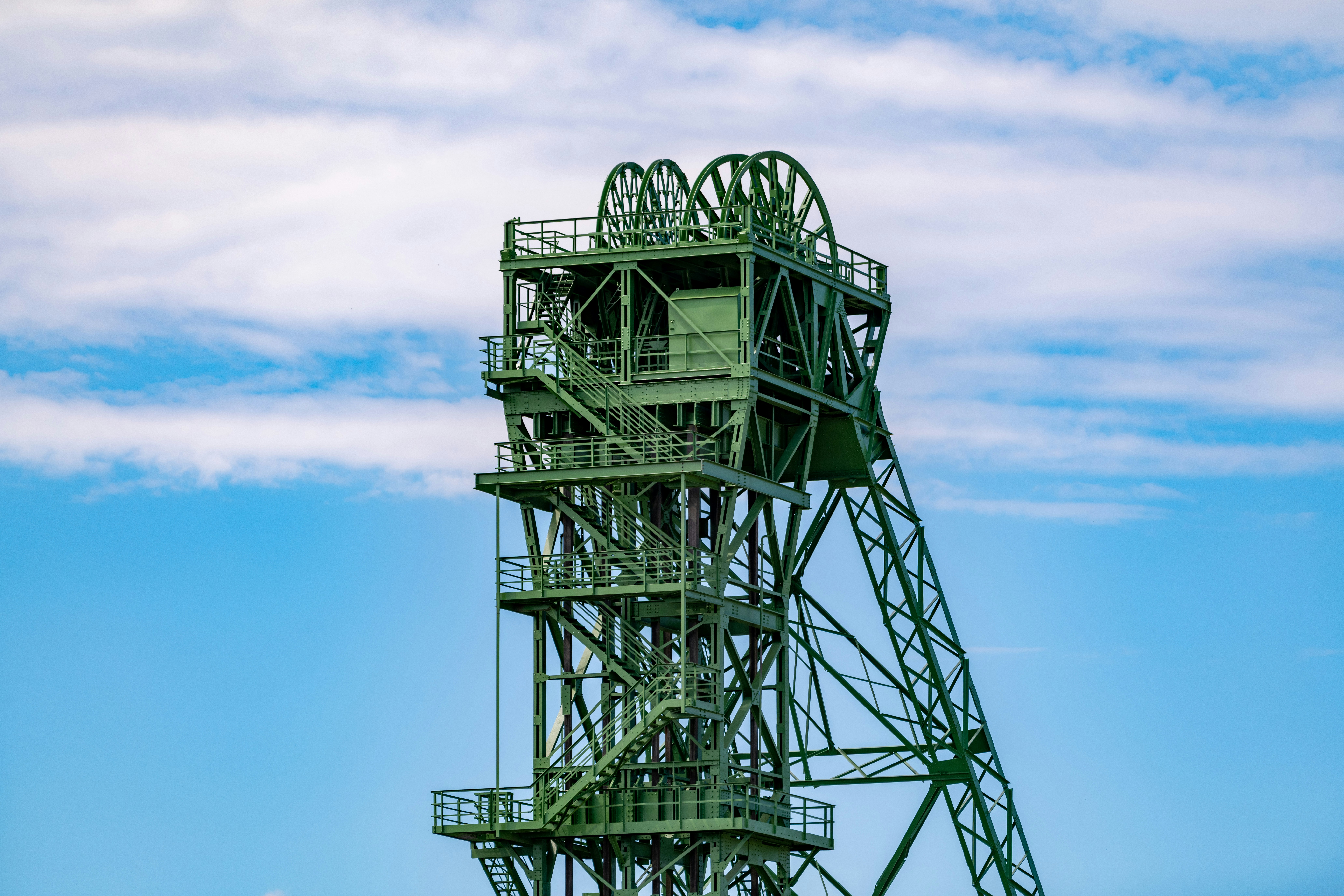 black metal tower under blue sky