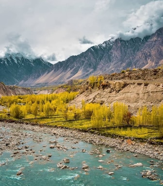 green and brown mountains under white clouds during daytime
