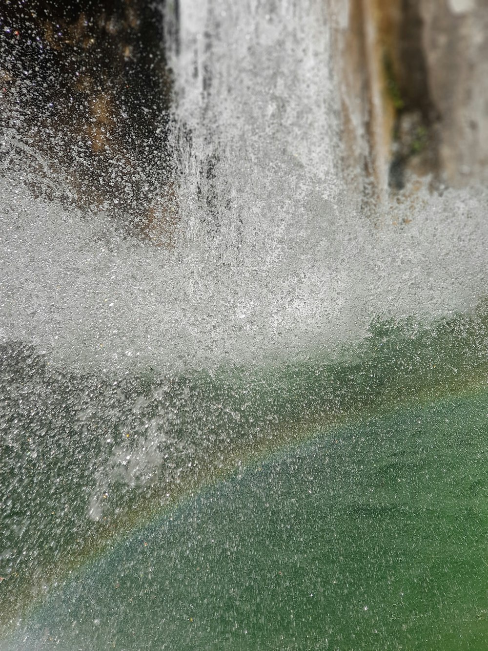 water falls in green field