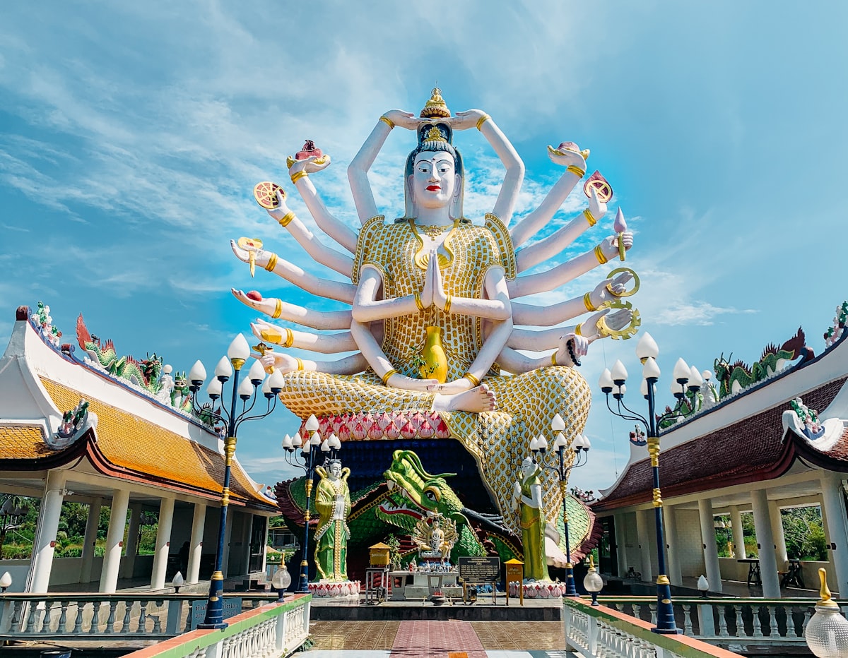 Koh Samui October — temple statue in monsoon season mist