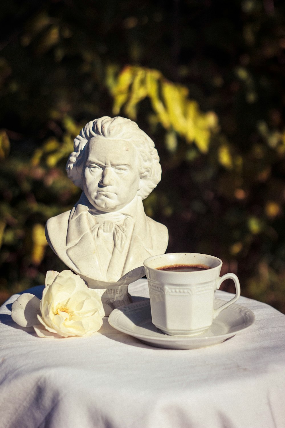 white ceramic teacup on saucer