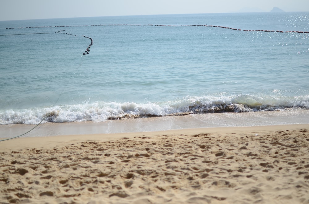 person surfing on sea waves during daytime