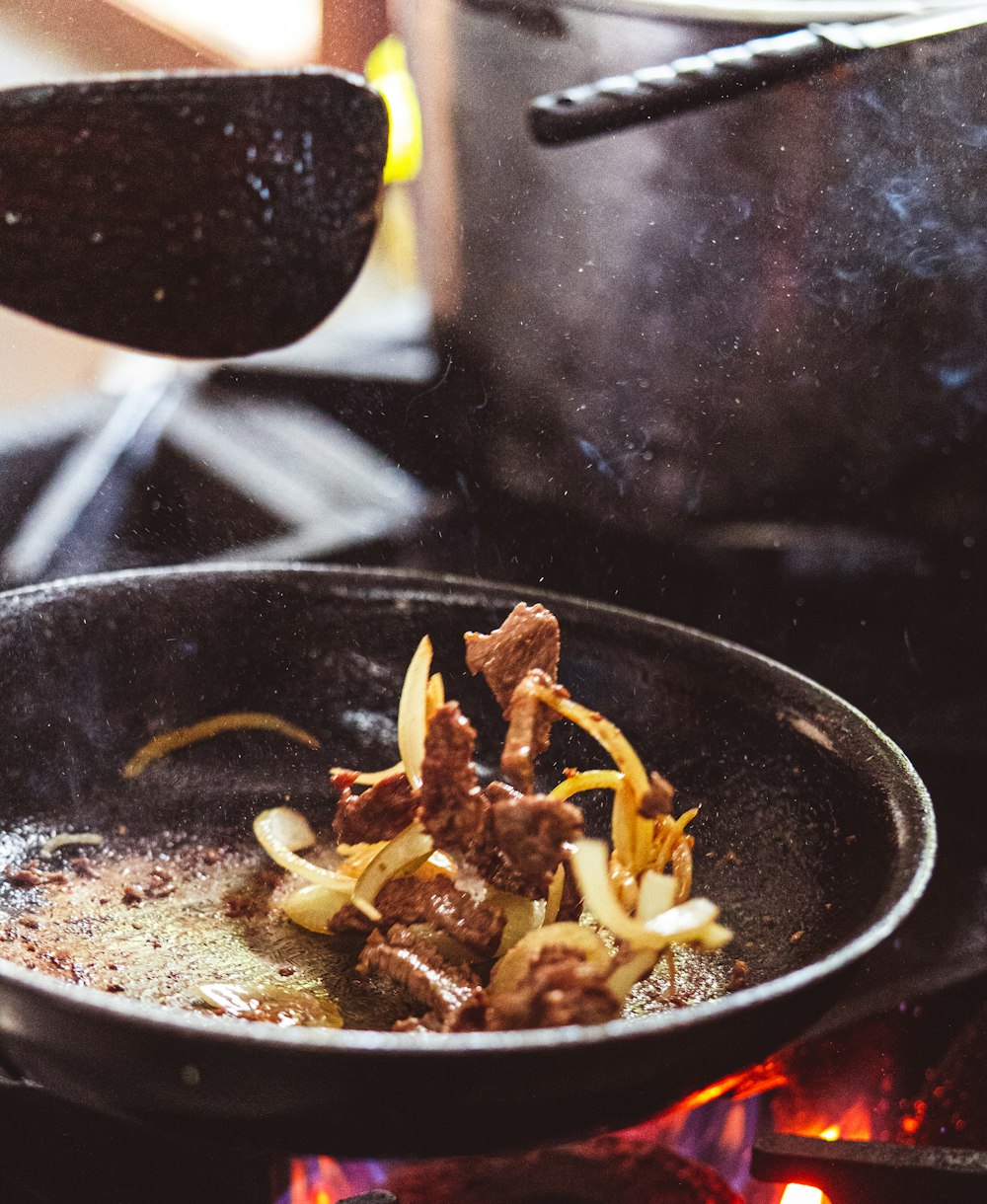 cooked food on black frying pan