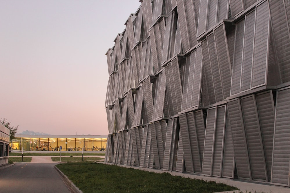 gray concrete building near green grass field during daytime