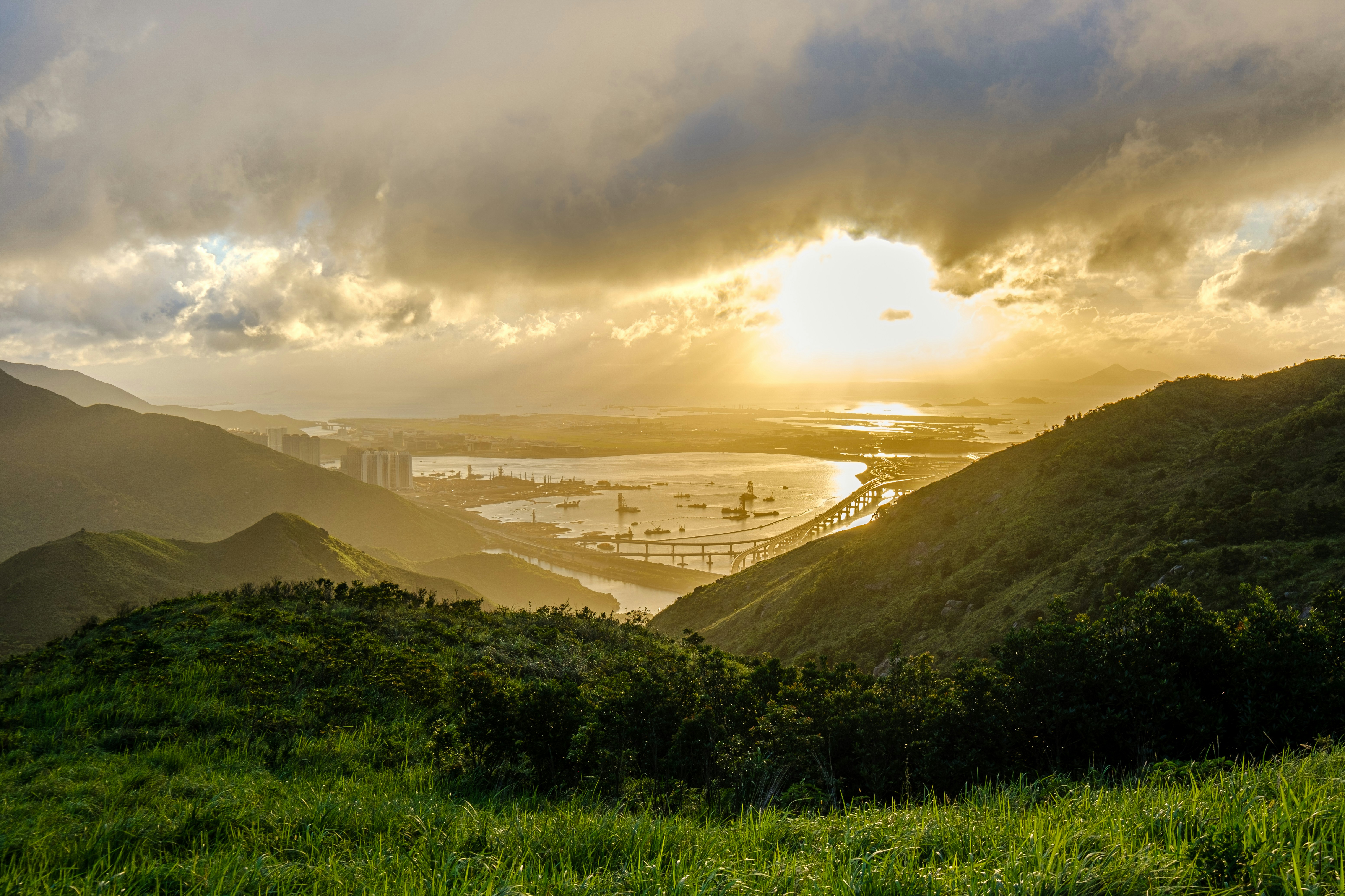 green grass field near mountain during daytime