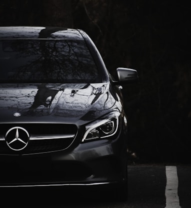 black mercedes benz c class on road during daytime