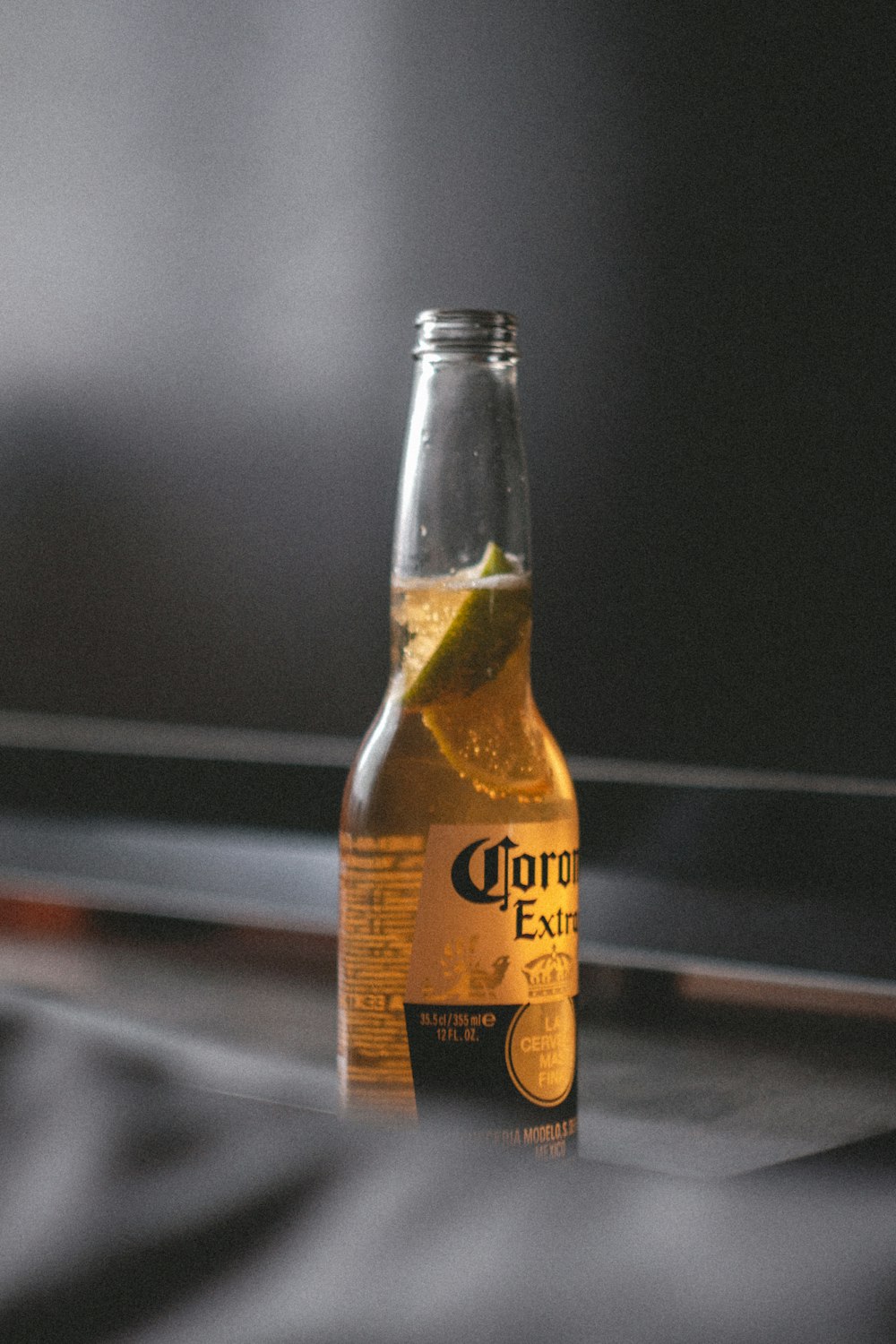 yellow labeled bottle on brown wooden table