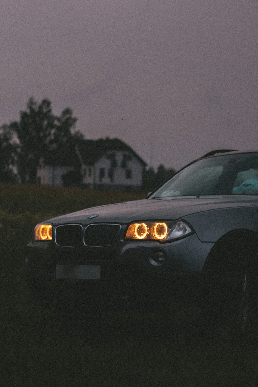 black car on road during night time