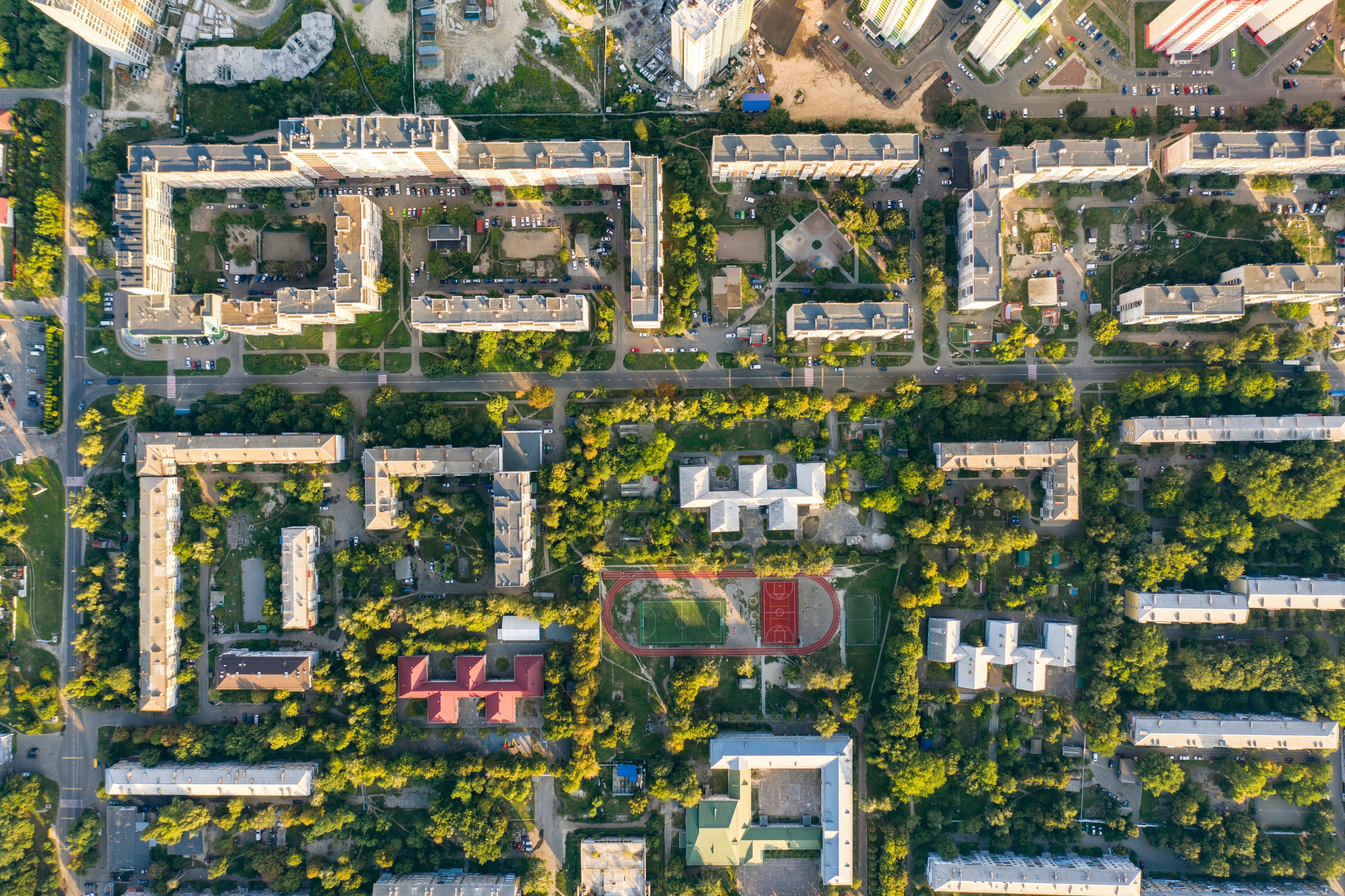 this is an aerial view of a college campus with trees and building. 
