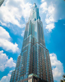 low angle photography of high rise building under blue sky during daytime