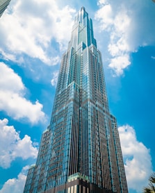 low angle photography of high rise building under blue sky during daytime