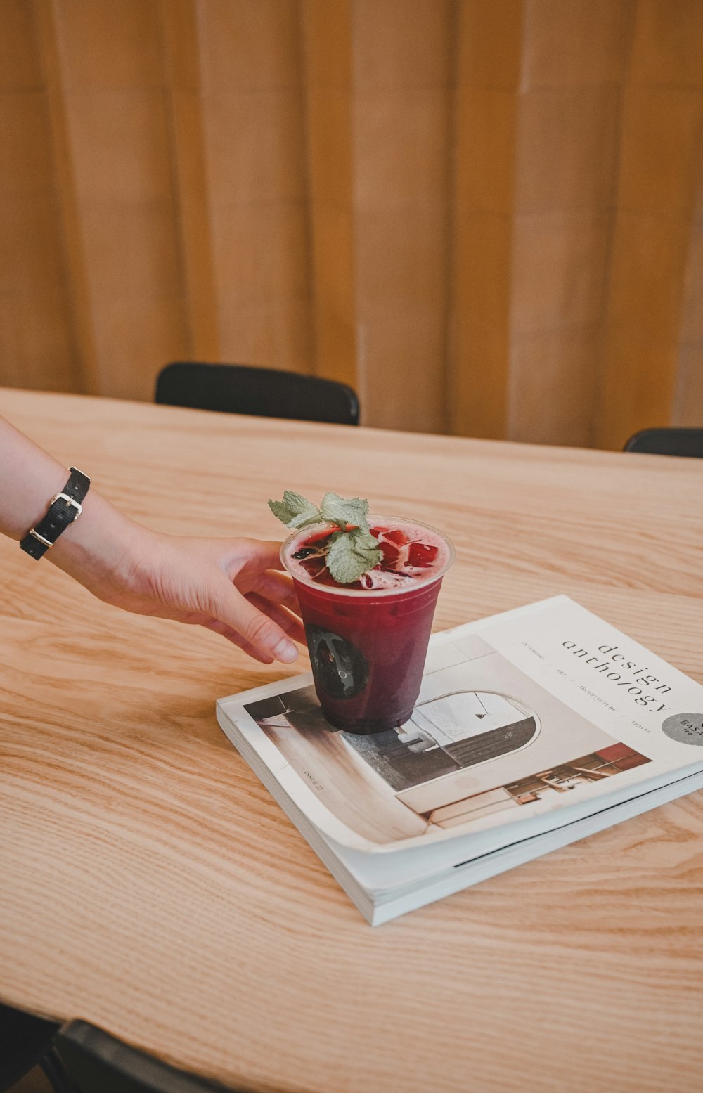 person holding red plastic cup