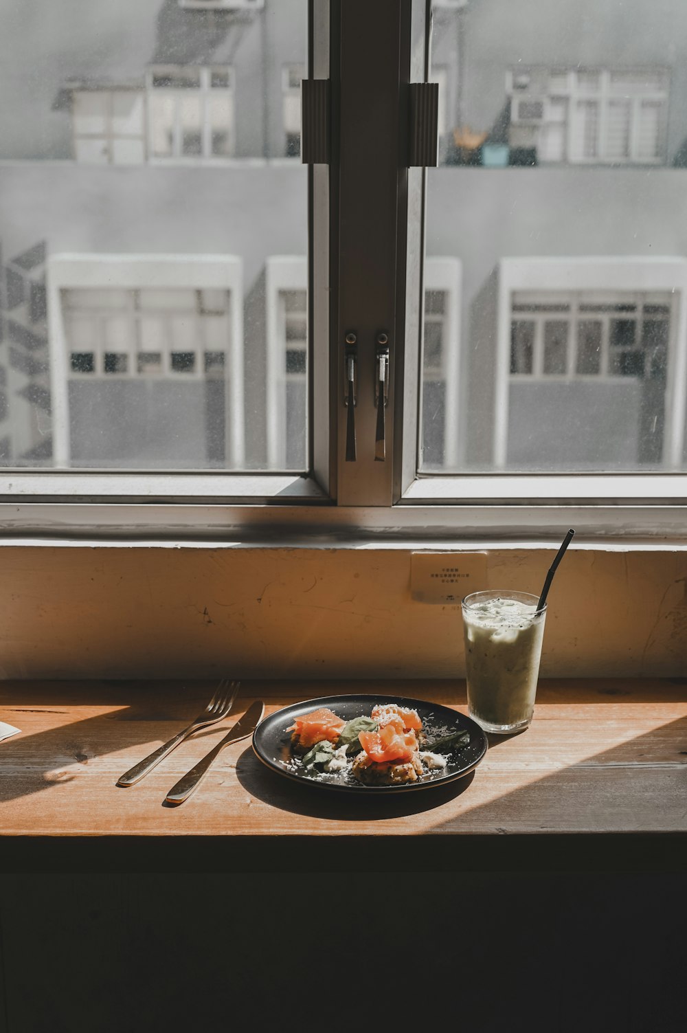 black ceramic bowl on brown wooden chopping board