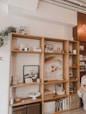 brown wooden shelf with figurines