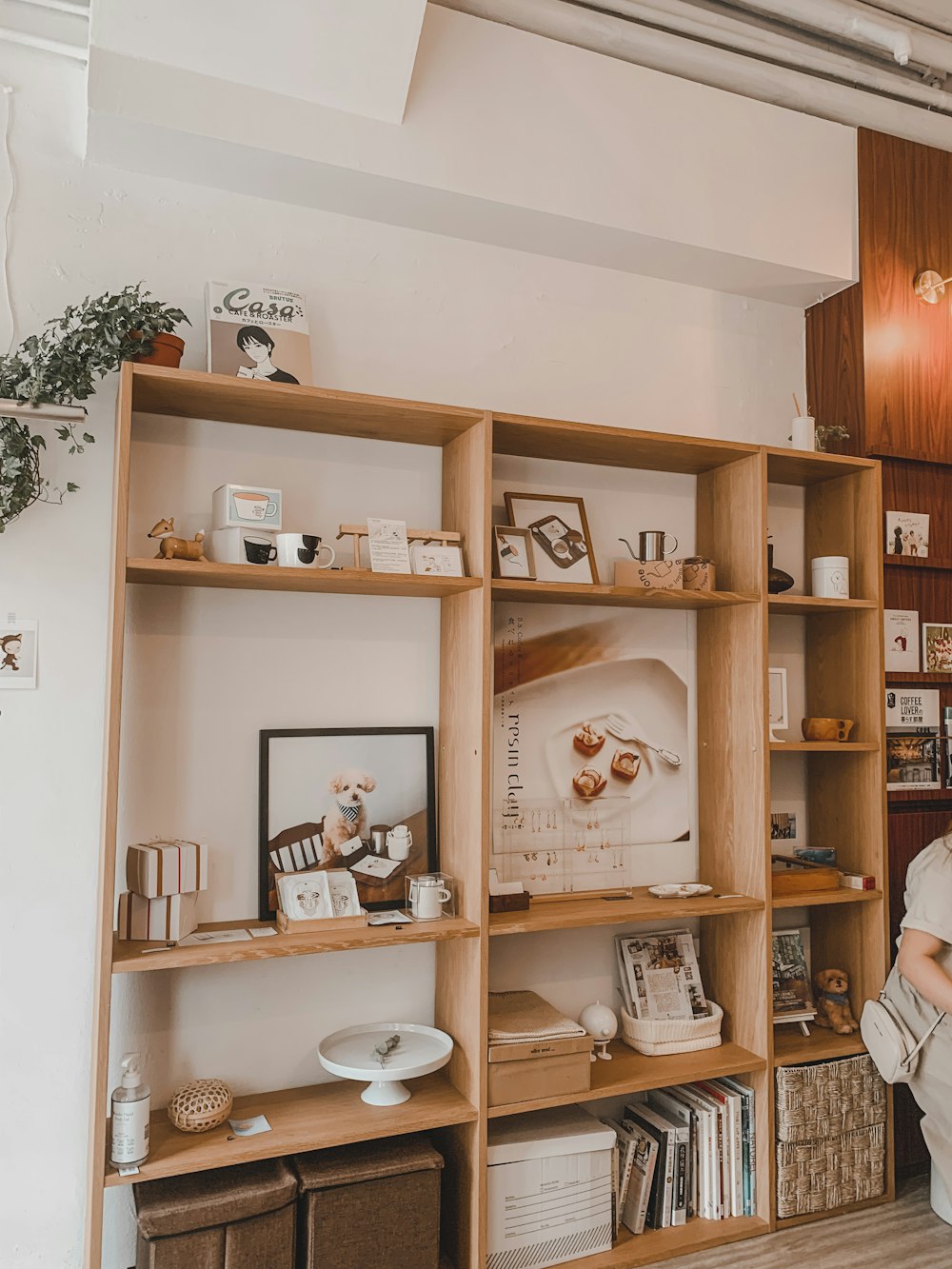 brown wooden shelf with figurines