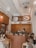 A cozy coffee shop interior filled with happy customers.