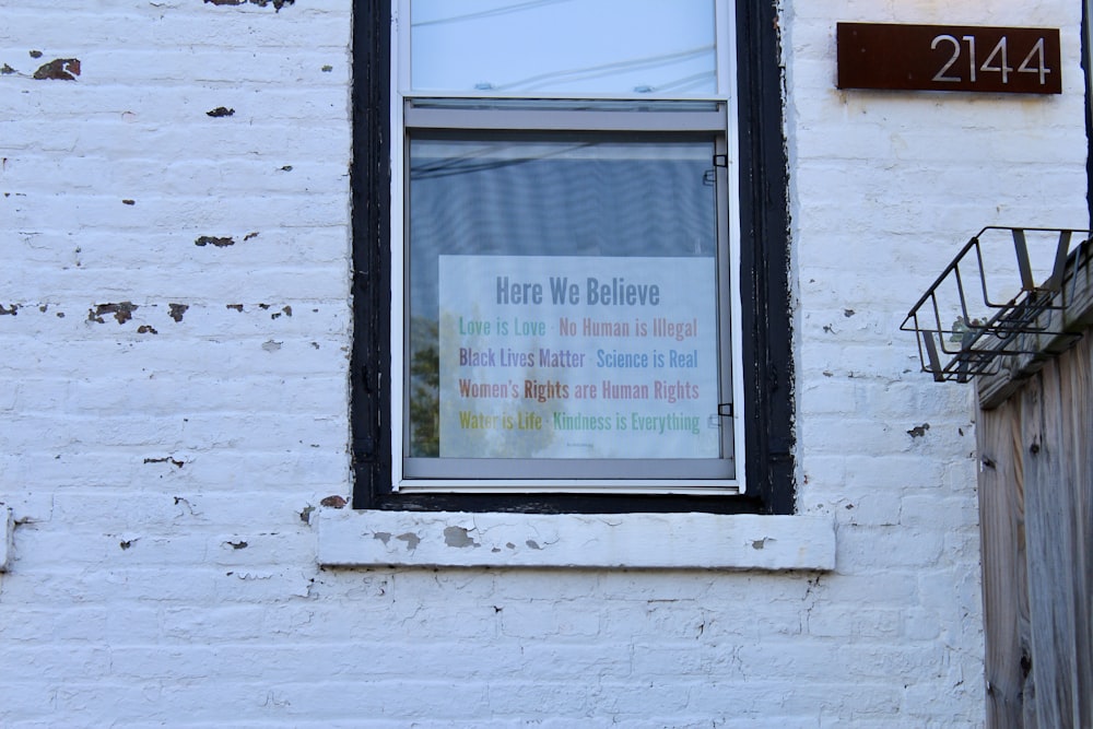 white wooden framed glass window