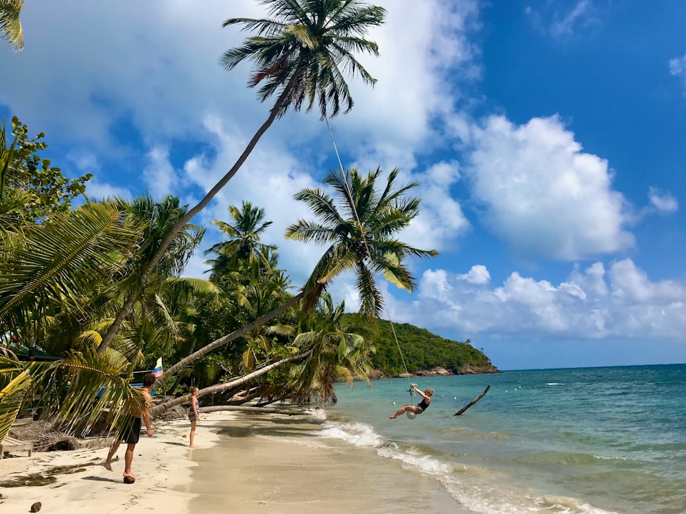 person surfing on beach during daytime