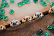 A collection of shimmering rings displayed on a rustic wooden table.