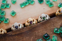 A collection of exquisite emerald rings on display.