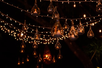 Festival decorations made from handcrafted jute and recycled paper, glowing warmly in natural light.