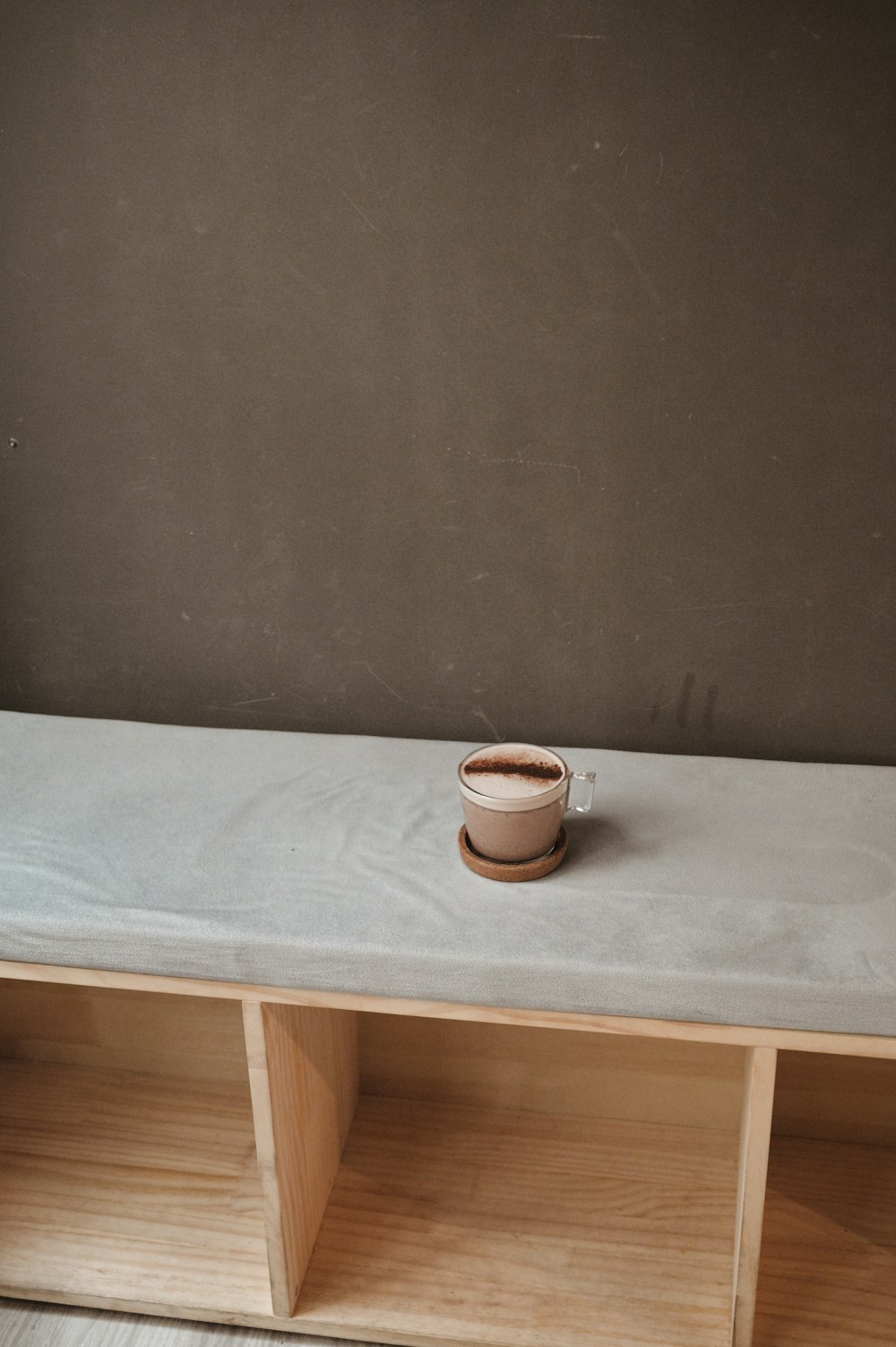 white ceramic mug on white ceramic saucer on white table