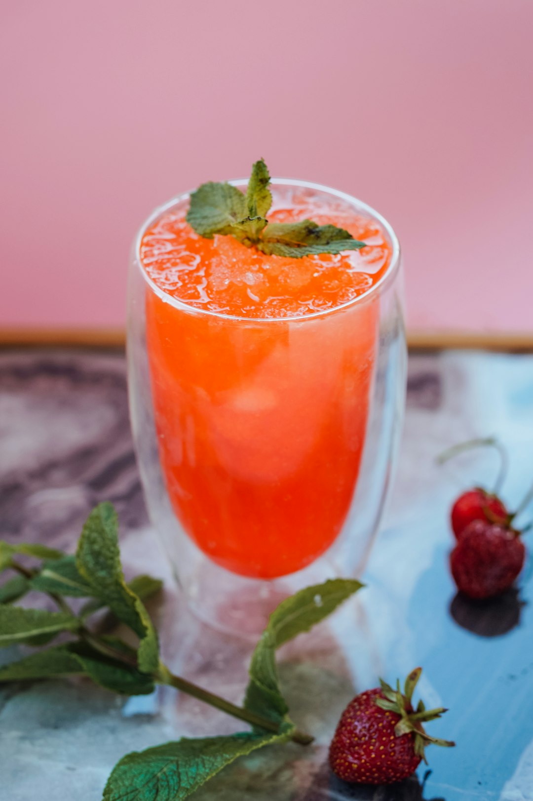 clear drinking glass with red liquid