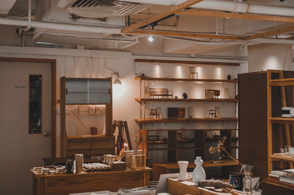 brown wooden table near brown wooden shelf