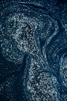 A swirling galaxy with faint symbols floating around, evoking cosmic wisdom.