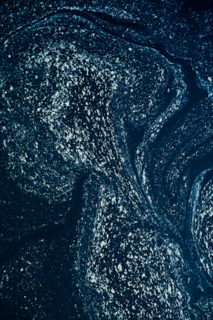 A shimmering quantum pattern overlaying a starry night sky reflecting cosmic mysteries.