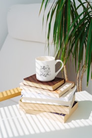 white ceramic mug on brown wooden table